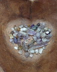 cacoxenite crystal chips in heart-shaped bowl