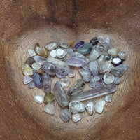 cacoxenite crystal chips in heart-shaped bowl