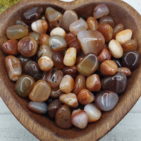 mini carnelian stones in heart-shaped bowl