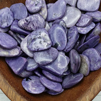 Charoite stones in heart-shaped bowl