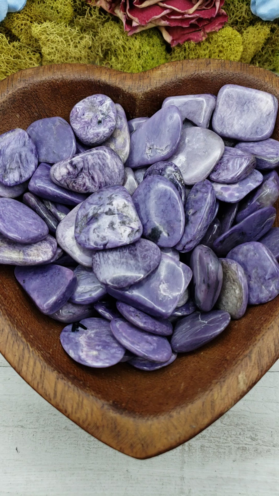 Charoite stones in heart-shaped bowl