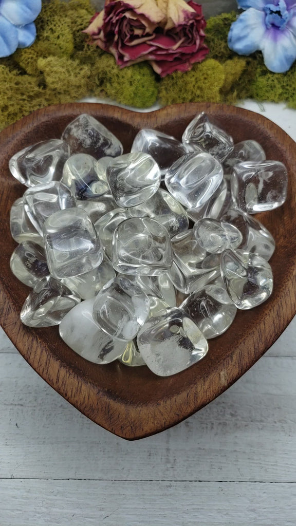 Clear obsidian stones in heart-shaped bowl