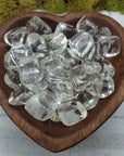 Clear obsidian stones in heart-shaped bowl