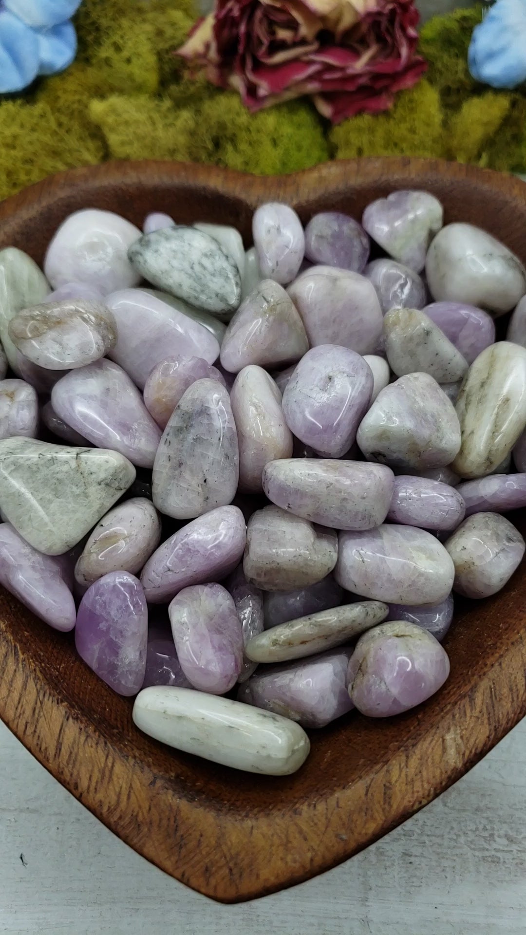 video of tumbled kunzite crystal pieces in wooden heart bowl