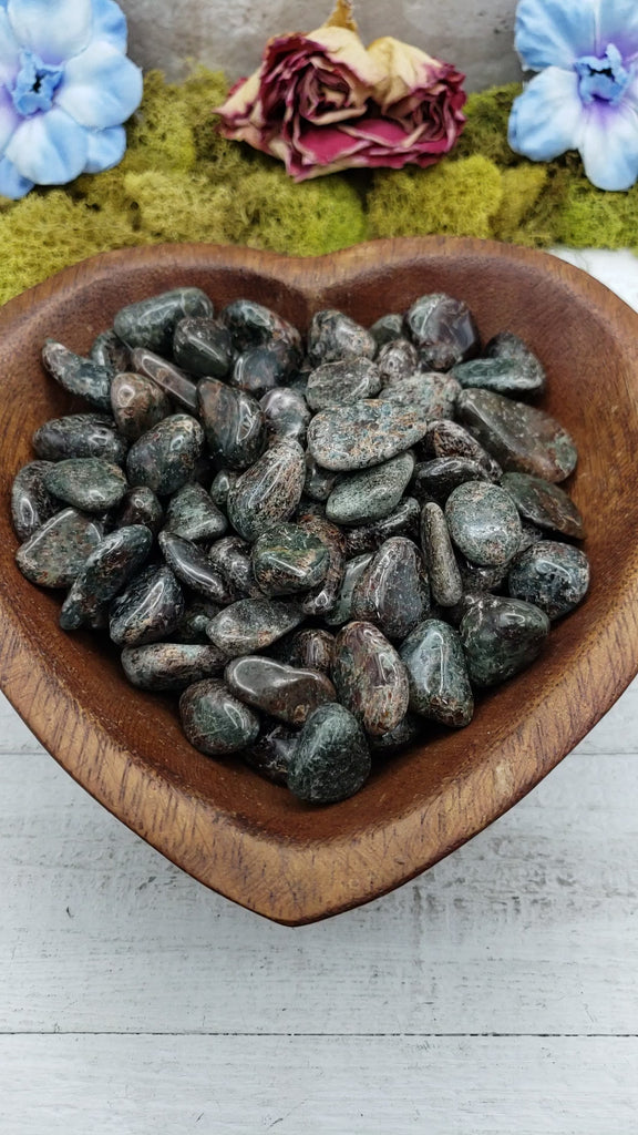 Video of red & green garnet crystals in heart shaped bowl