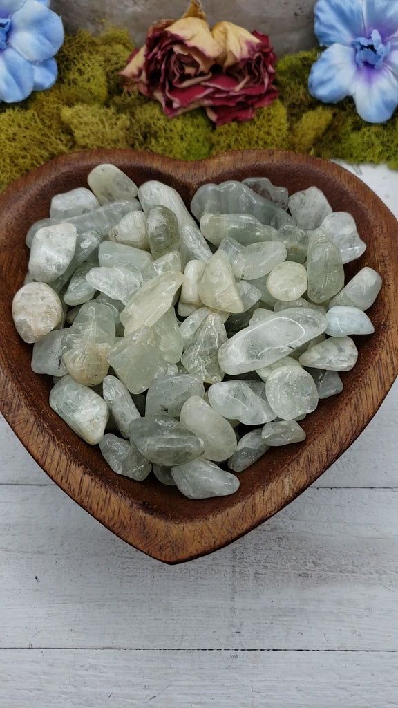 video of tumbled aquamarine stone pieces in bowl