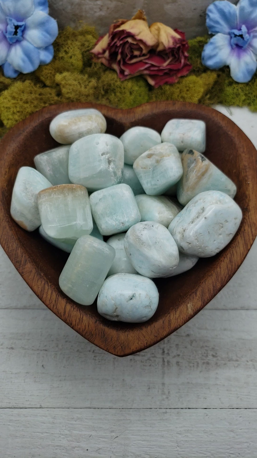 blue ocean caribbean calcite stones in heart-shaped bowl