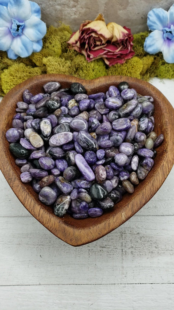 charoite stones in heart-shaped bowl