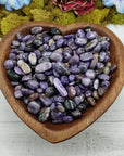 charoite stones in heart-shaped bowl