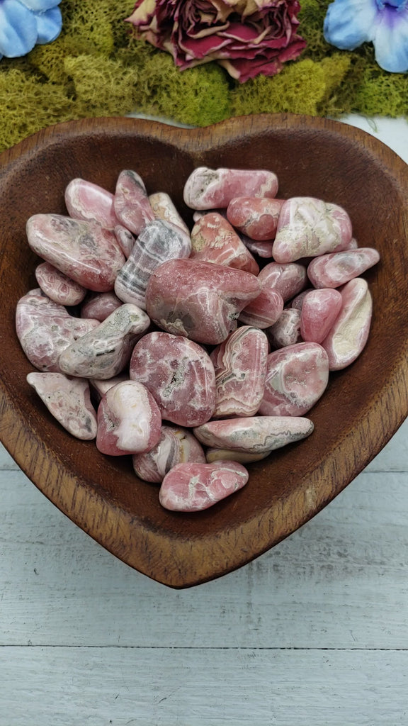 rhodocrosite stones in heart-shaped bowl