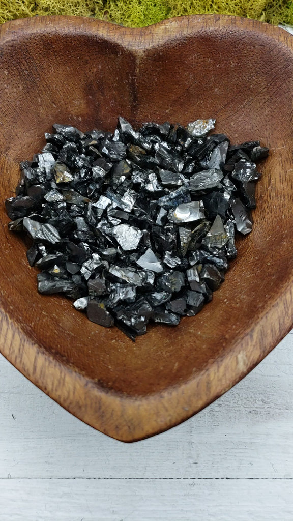 video of raw shungite crystal pieces in bowl