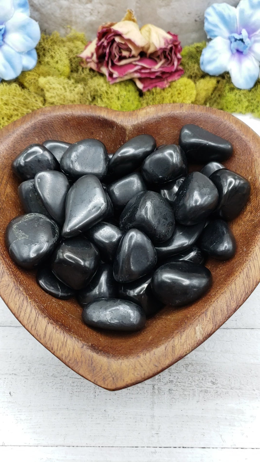 shungite stones in heart-shaped bowl