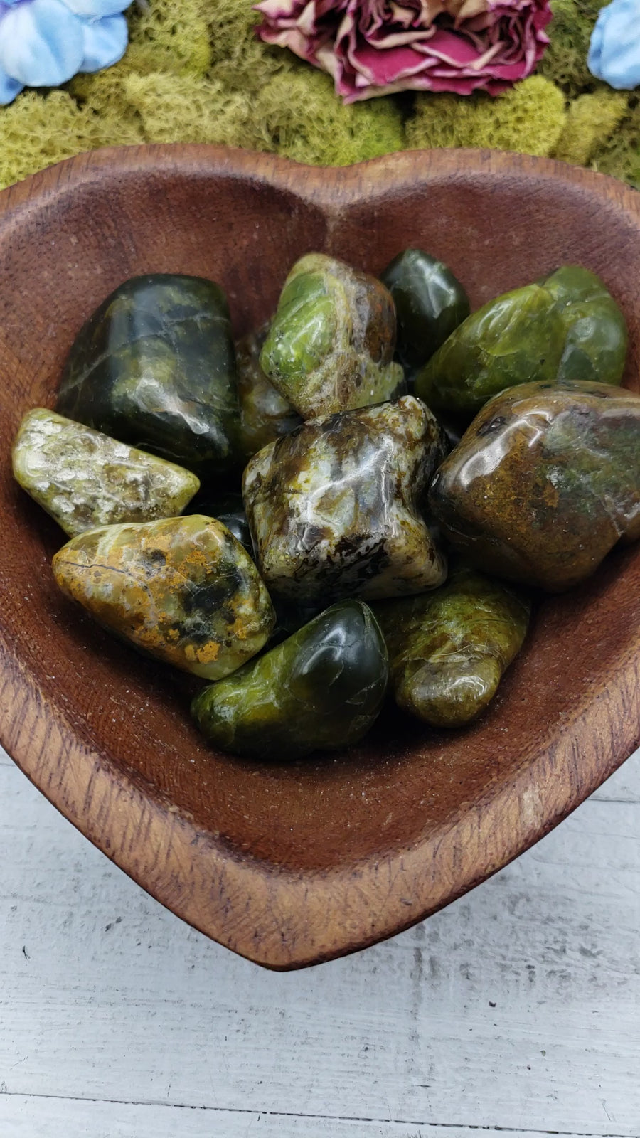 green opal stones in heart-shaped bowl