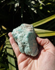 Video of rough amazonite in hand, showing of various sides