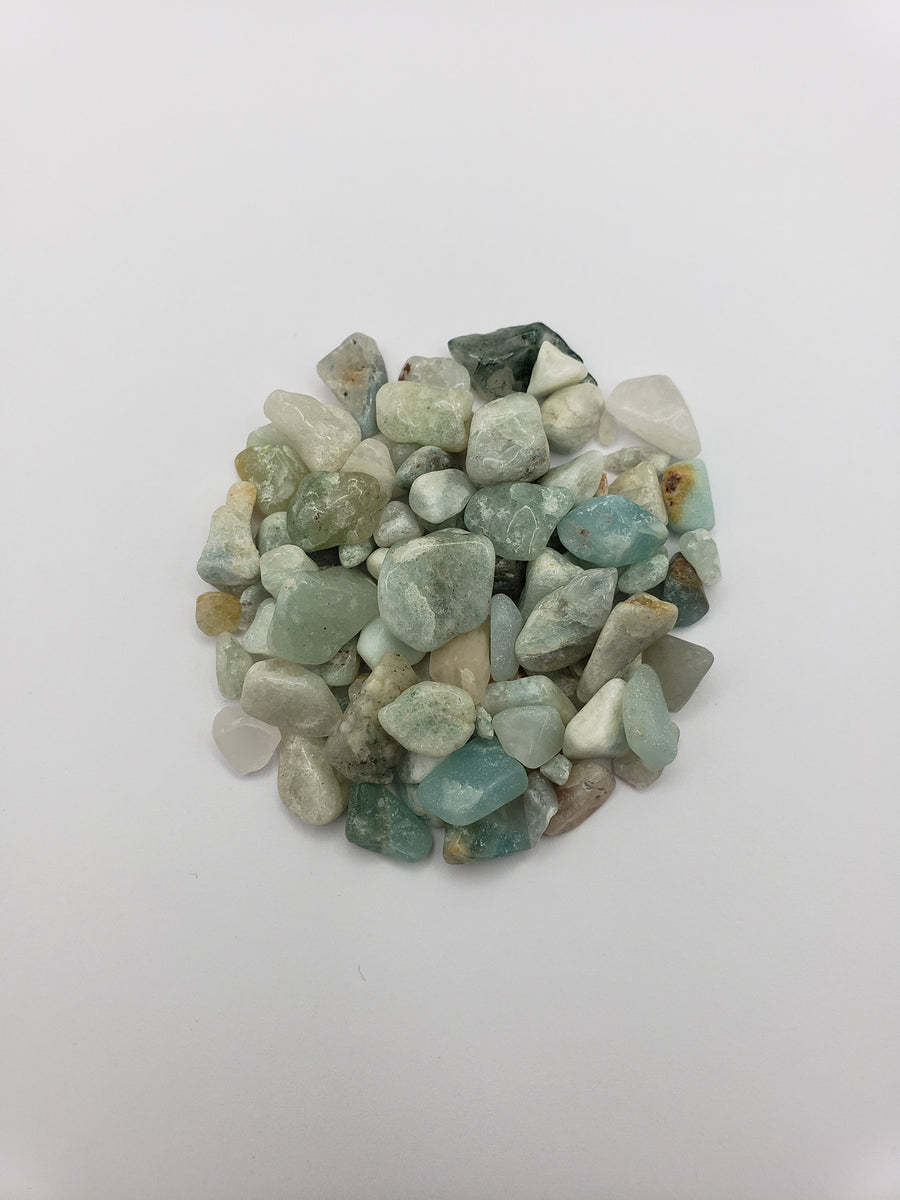 one ounce of amazonite chips on white background