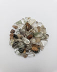 One ounce of green phantom quartz chips on white background