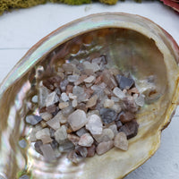 One ounce of moonstone crystal chips in abalone shell