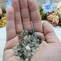 One ounce of mixed agate chips in hand