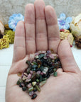 One ounce of mixed multi tourmaline chips in hand