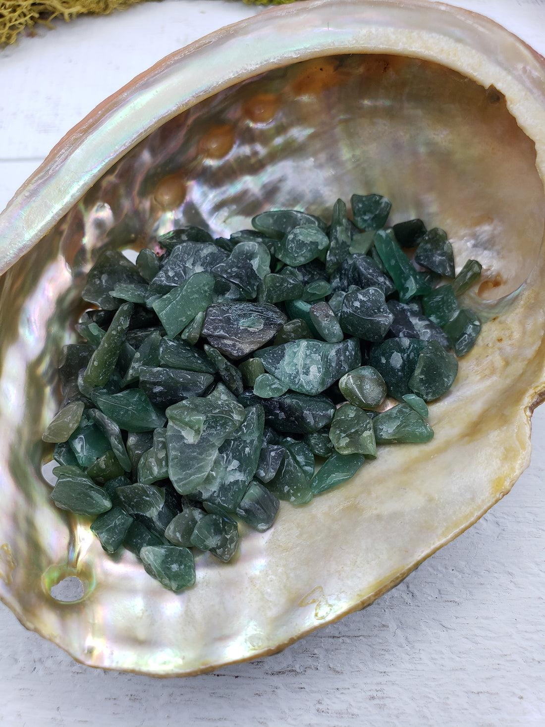 One ounce of green aventurine chips in abalone shell