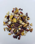 One ounce of mookaite crystal chips on white background