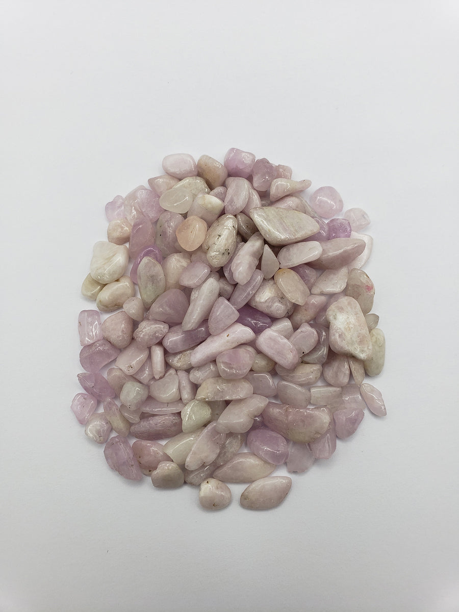 One ounce of kunzite stone chips on white background
