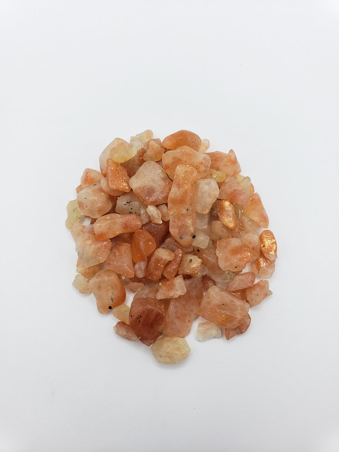 one ounce of sunstone chips on white background