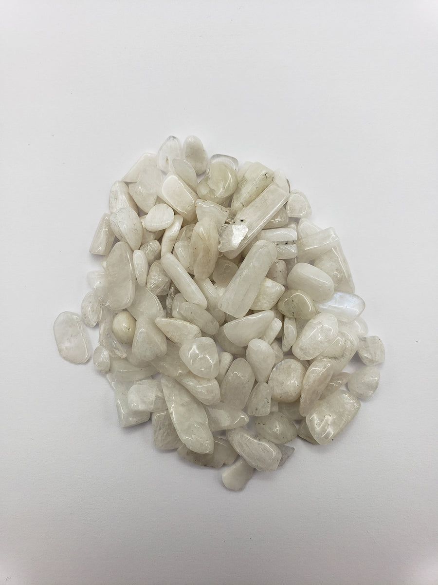 One ounce of rainbow moonstone chips on white background