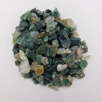 One ounce of moss agate chips on white background