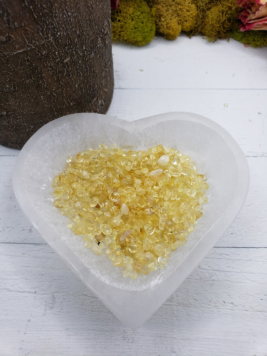 1 ounce of citrine crystal chips in selenite bowl