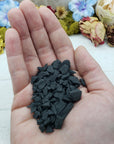 hand holding rough shungite stone chips