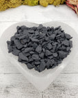 selenite bowl with rough shungite stone chips