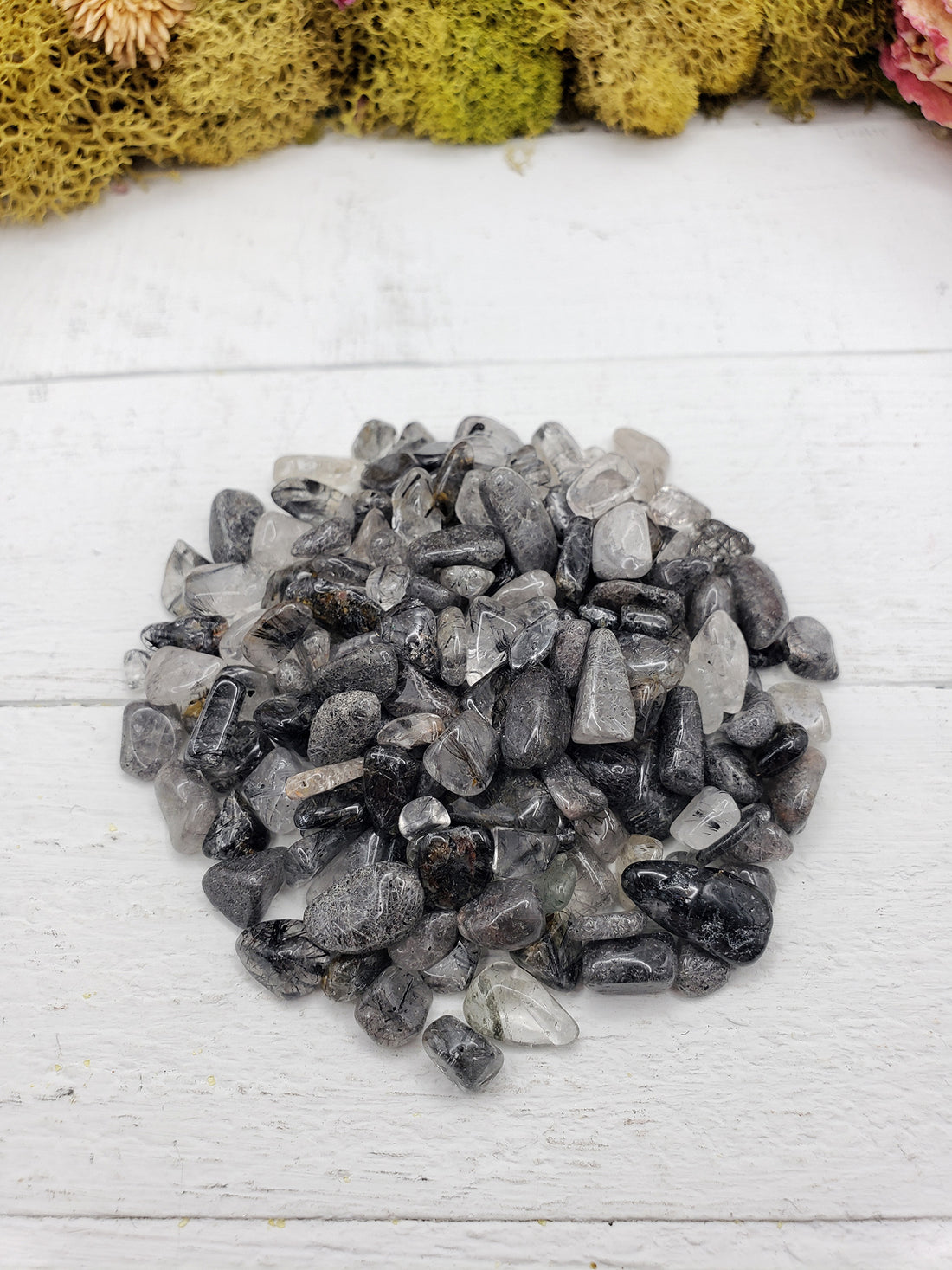 2 ounces of black tourmaline rutilated quartz on display