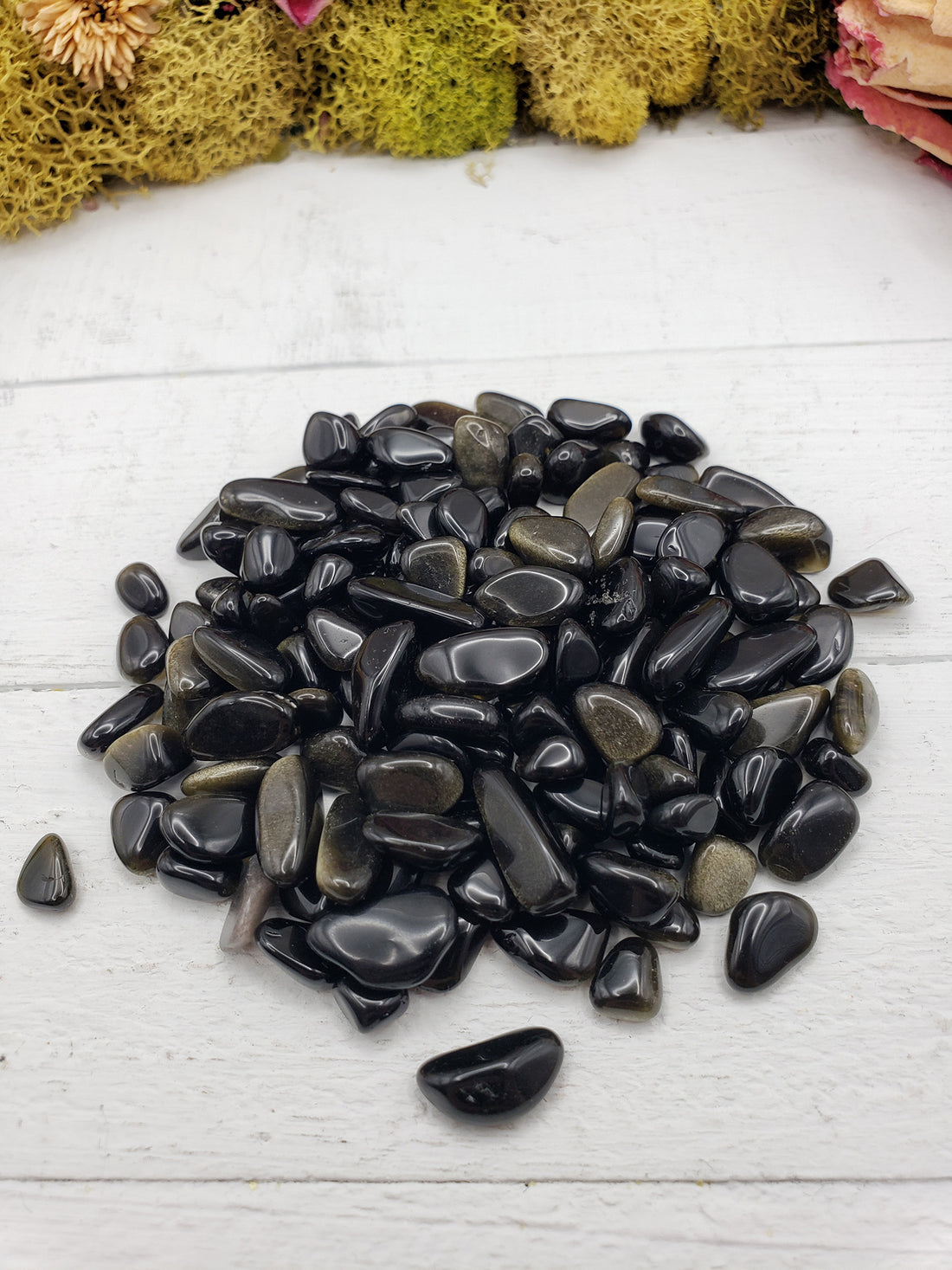 Two ounces of gold sheen obsidian chips on display