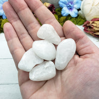 Milky quartz stone pieces in hand