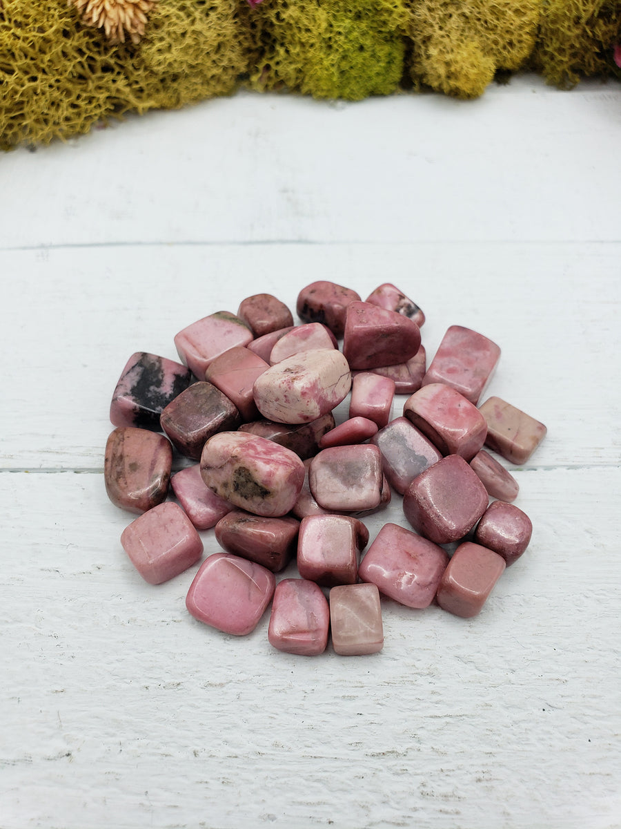 Two ounces of pebble-sized rhodonite crystals on display 