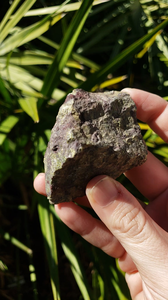 Video of hand showing rough dragon stone in sunlight