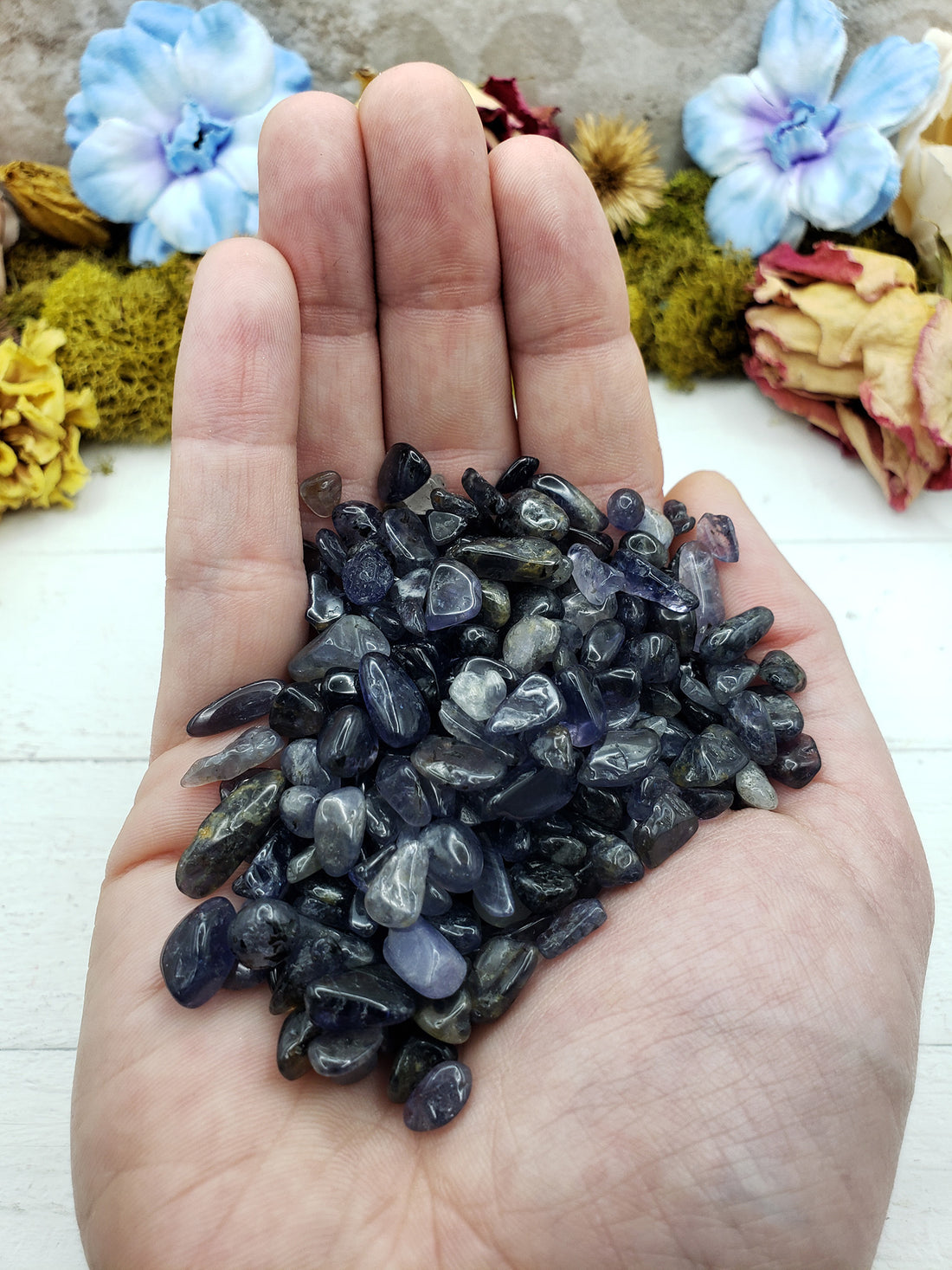 Three ounces of iolite crystal chips in hand