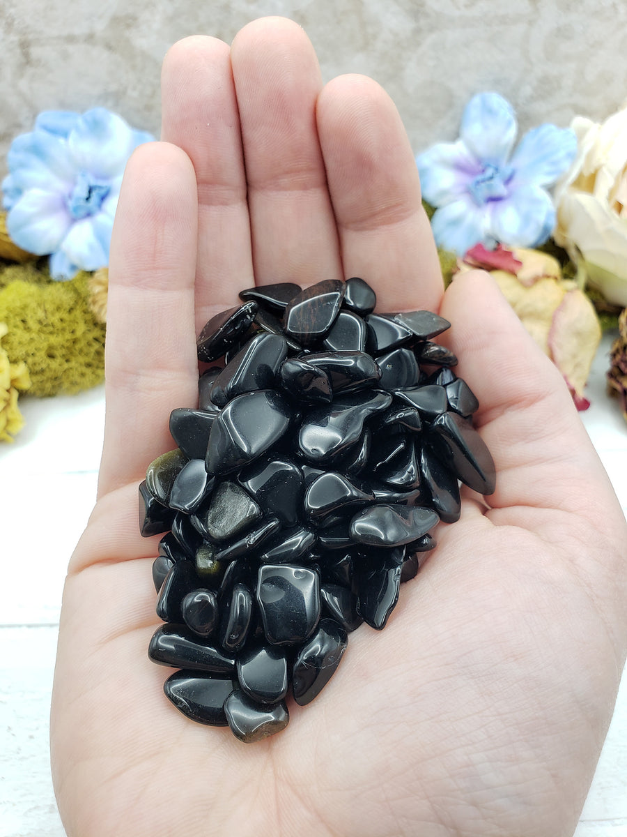 Three ounces of obsidian crystal chips in hand