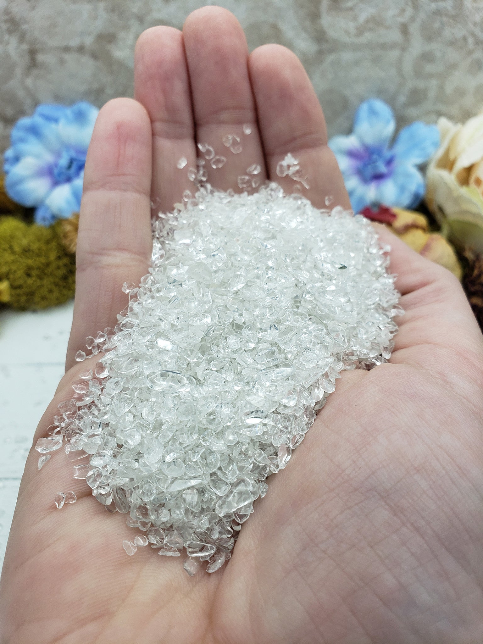 three ounces of quartz crystal chips in hand