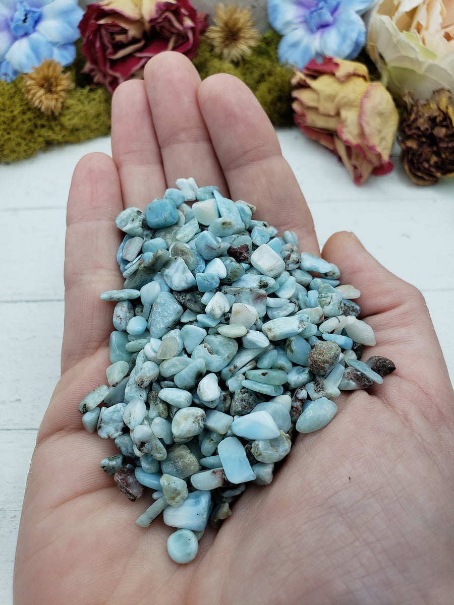 Three ounces of larimar crystal chips in hand