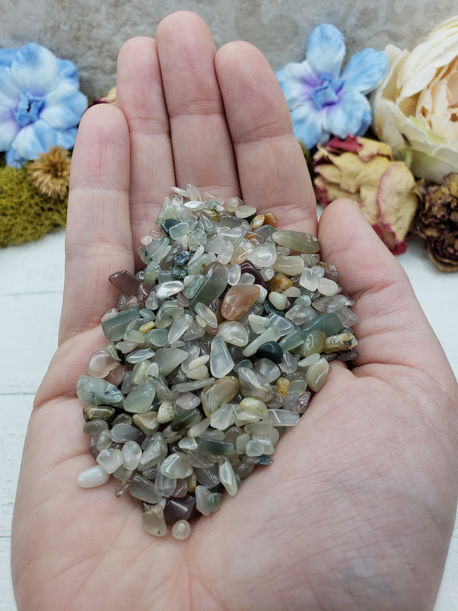 Three ounces of mixed agate crystal chips in hand