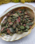 three ounces of unakite stone chips in abalone shell