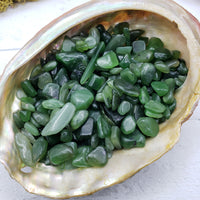 Three ounces of nephrite jade chips in abalone shell