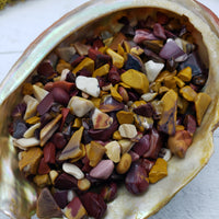 Three ounces of mookaite crystal chips in abalone shell