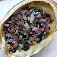 Three ounces of mixed multi tourmaline crystal chips in abalone shell