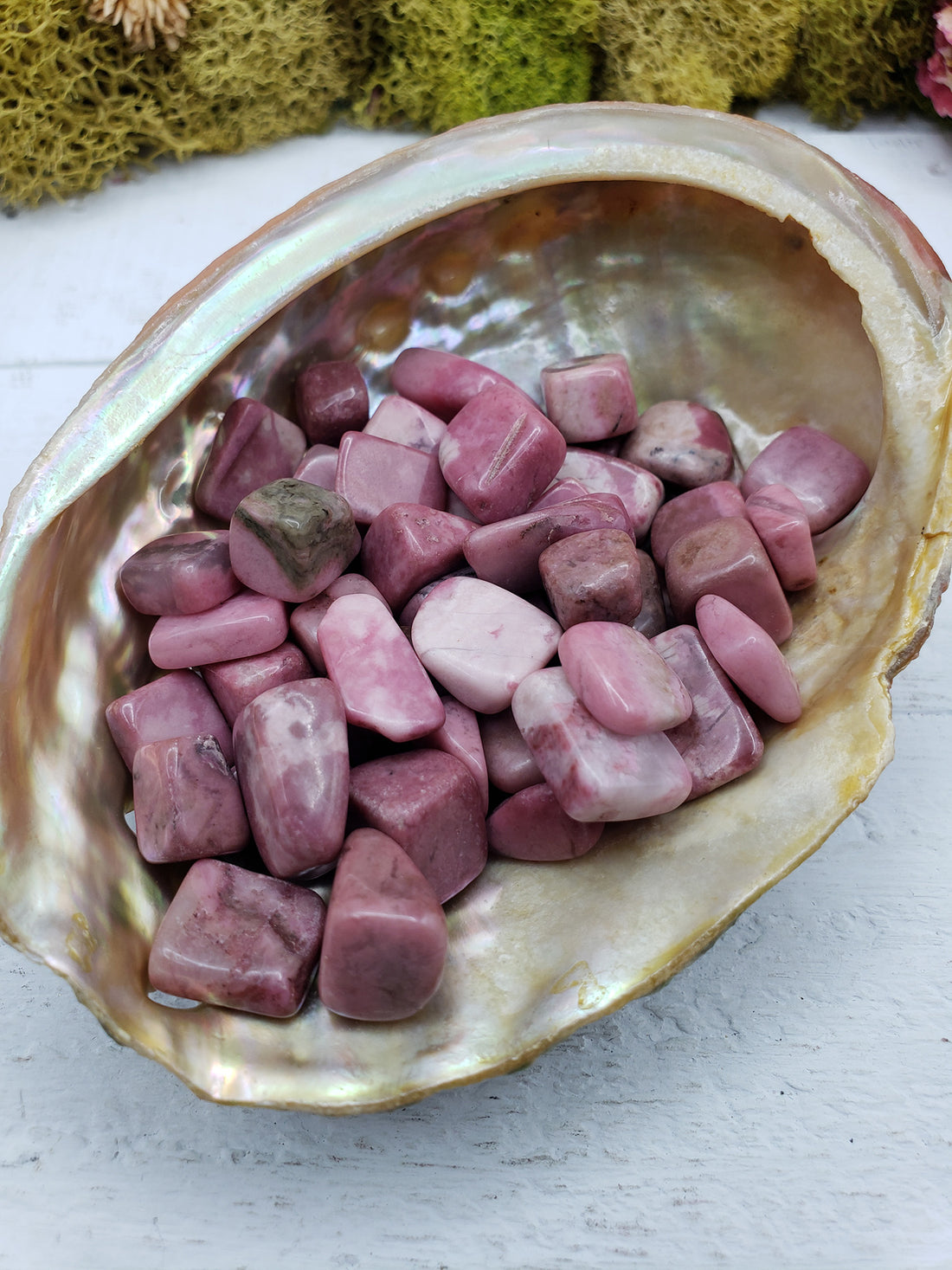 Three ounces of pebble-sized rhodonite chips in abalone shell 