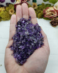 four ounces of amethyst crystal chips in hand
