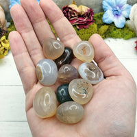 snakeskin agate stones in hand