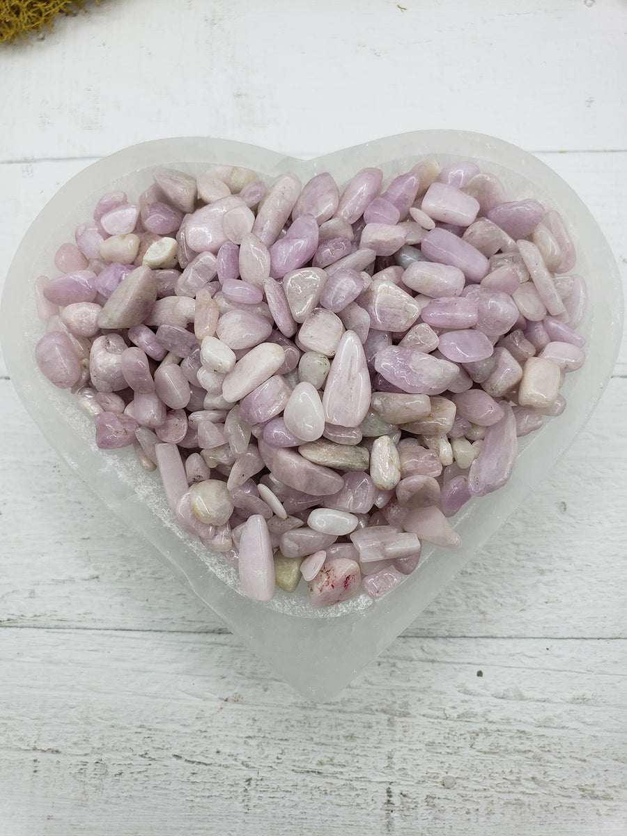 Five ounces of kunzite stone chips in selenite bowl